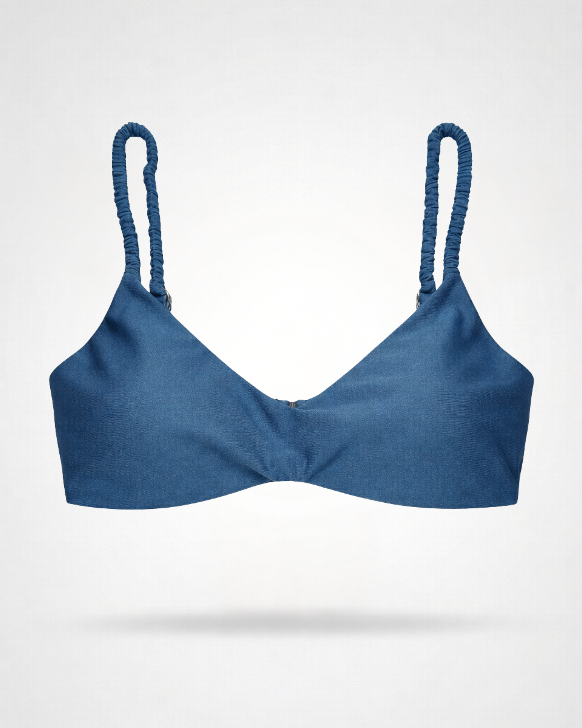 Blue bikini top with rushed straps on a white background