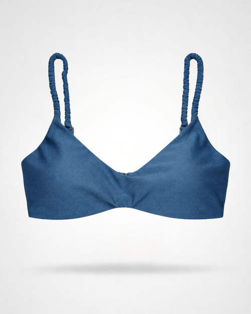 Blue bikini top with rushed straps on a white background