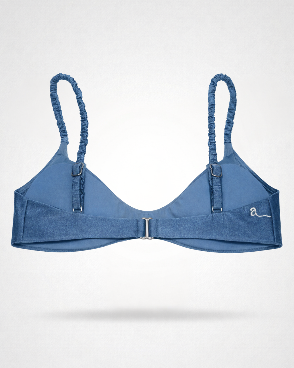 Blue bikini top with rushed straps on a white background