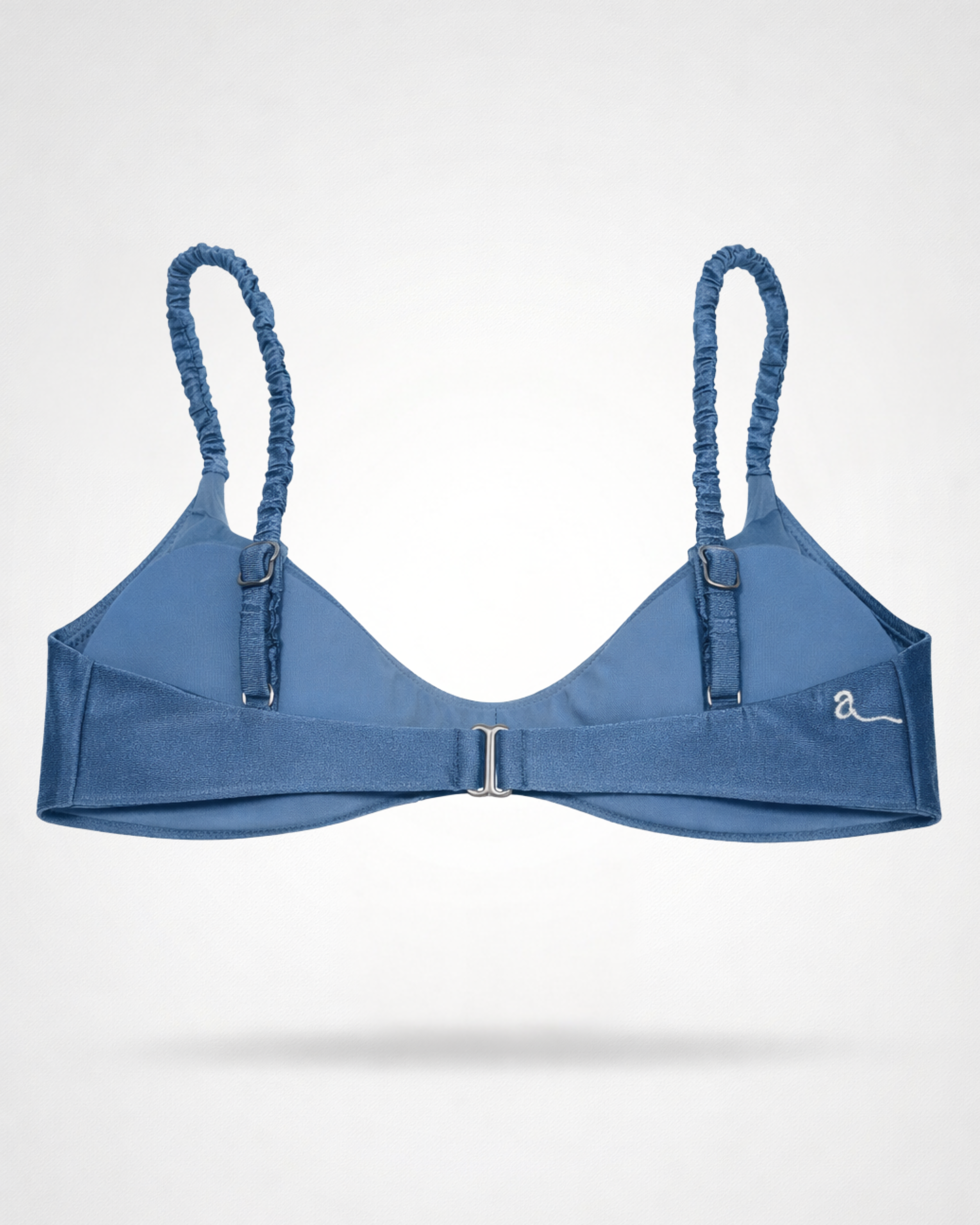 Blue bikini top with rushed straps on a white background